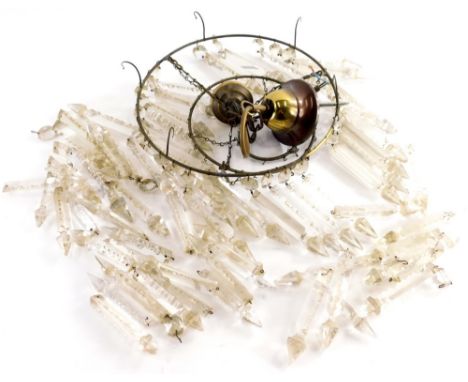 An early 20thC brass framed hanging light fitting, with a graduated arrangement of glass droplets, 27cm diameter.