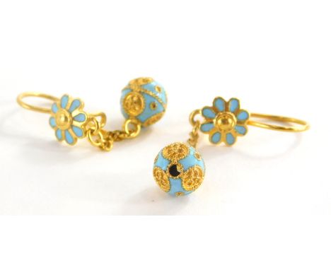 A pair of Eastern style enamel drop earrings, each with pale blue enamel flower and ball design, in yellow metal, marked 750,