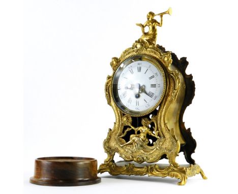 A 19thC French mantel timepiece, in brass case, decorated with Neoclassical figures, etc., the white enamel dial with Roman n