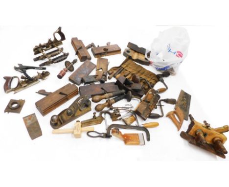 A quantity of wood working tools, to include stamped planes, etc.