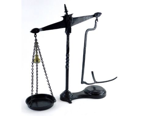 A set of wrought iron black painted beam scales, 50cm high.
