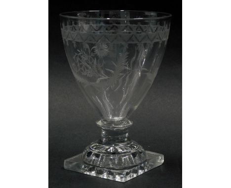 A late 18thC/early 19thC glass rummer, with engraved decoration of leaves, birds surrounding a monogram, with lemon squeezer 