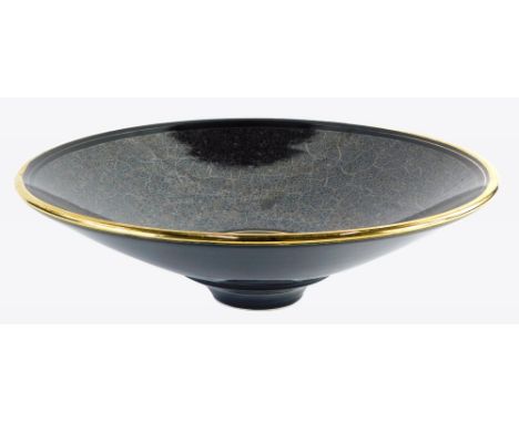 A studio ceramic shallow bowl, with bronzed and gilt decoration, signed indistinctly to underside, Sallis, 41cm diameter.