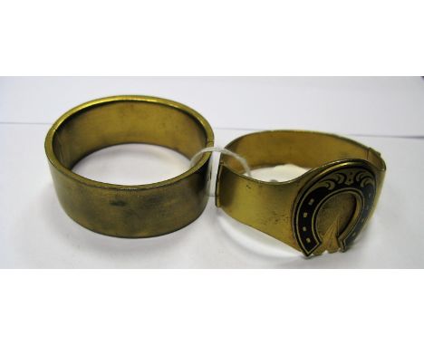 A Victorian Horseshoe Bangle, of shaped design, highlighted in black, hinged to snap clasp; together with another bangle, of 