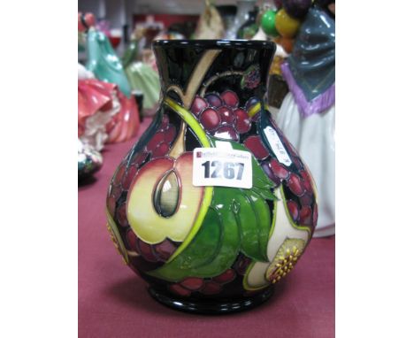 A Moorcroft First Quality Pottery Vase, in the 'Queens Choice' pattern, designed by  Emma Bossons, shape 869/6, 15.5cm high.