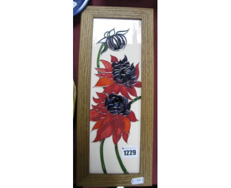 A Moorcroft First Quality Pottery Plaque, in the 'Ruby Red' pattern, designed by Emma Bossons, shape PLQ3, 30  x 9.5cm.
