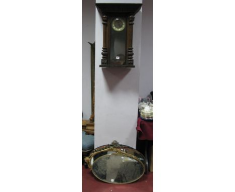 A Circa 1900 Mahogany Cased Vienna Style Wall Clock, (incomplete) and four oval wall mirrors. (5)