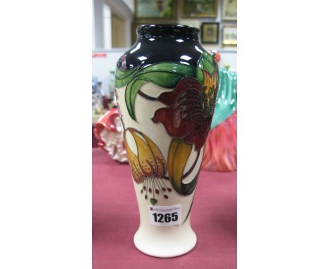 A Moorcroft First Quality Pottery Vase, in the 'Anna Lily' pattern, designed by Nicola Slaney, shape 122/8, 20cm high.