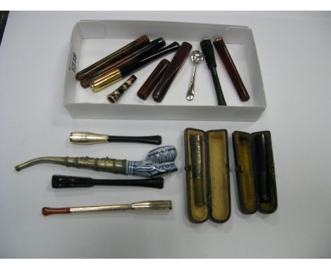 A Collection of Assorted Cheroot Holders, and a pipe.