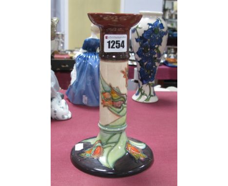 A Moorcroft Pottery Candlestick, tubelined and painted in the Red Tulip pattern against a cream ground with red/brown circula
