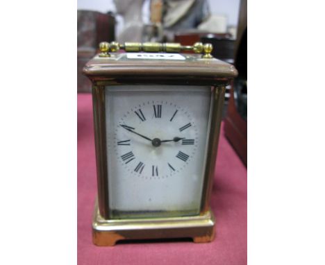 Brass Cased Carriage Clock, with black Roman numerals to white dial, R & C Paris to back plate. 
