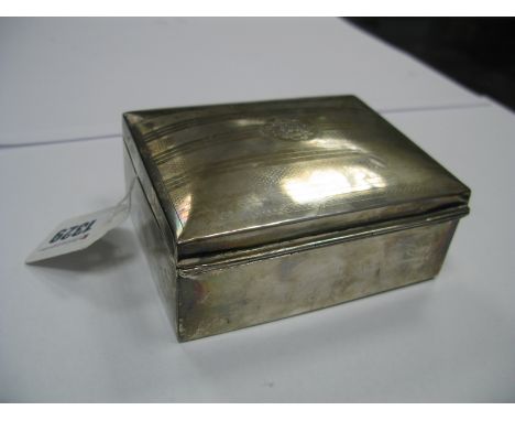 A Hallmarked Silver Cigarette Box, of rectangular form with engine turned lid, initialled, 11.5cm wide.