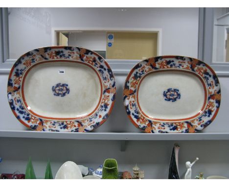 Two Graduating Victorian Earthenware Meatplates, transfer print of scroll and foliage in an ochre and cobalt blue ground, gil
