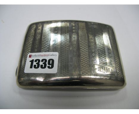 A Hallmarked Silver Cigarette Case, of rectangular form, allover engine turned, initialled "WGE" inside engraved with an Armo