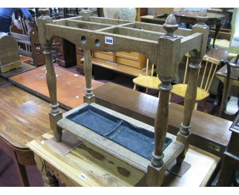 Early XX Century Oak Stick Stand, with finial pops, on turned and block supports, with drip tray.