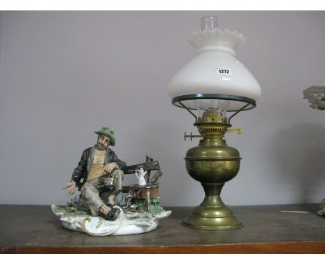 Capo-Di-Monte Figure of Seated Tramp, stamped Tyche Tosca, brass oil lamp with white glass shade. (2)