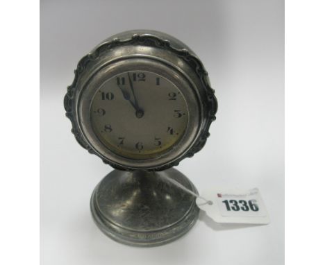 A Hallmarked Silver Cased Bedside Clock, JR, Birmingham 1925, the circular dial with black Arabic numerals, within shaped fra