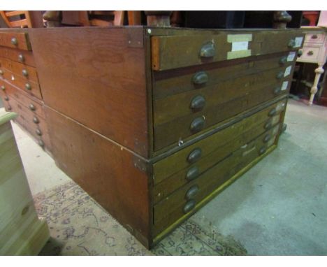 A vintage stained wooden two sectional plan chest of eight index drawers with brass cup handles 122 cm x 86 cm approx