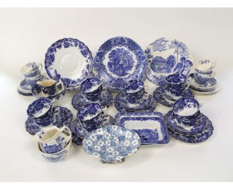 A collection of early 20th century blue and white printed tea wares with floral decoration including slop bowl, milk jug, a p