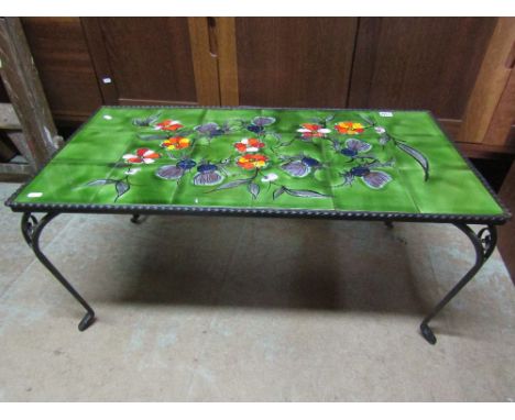 An Italian tile top coffee table, the tiles in the form of a floral bouquet with thistles upon wrought iron cabriole legs, 93