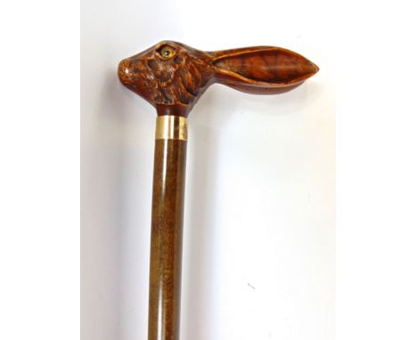 A Malacca shafted walking stick, the knop in the form of a carved hare's head