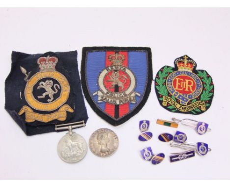 A collection of Kenyan police breast pocket badges, cufflinks and tie clasps, 39-45 war medal, Elizabeth II Africa medal