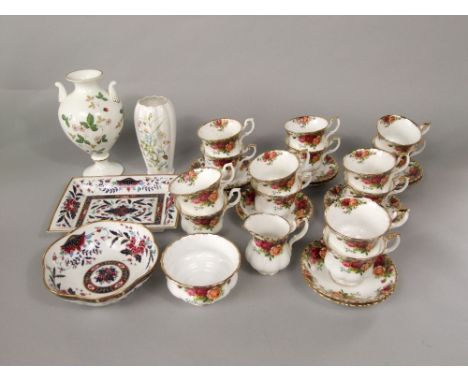 A collection of Royal Albert Old Country Roses pattern tea wares comprising a milk jug and sugar bowl, fourteen cups and elev