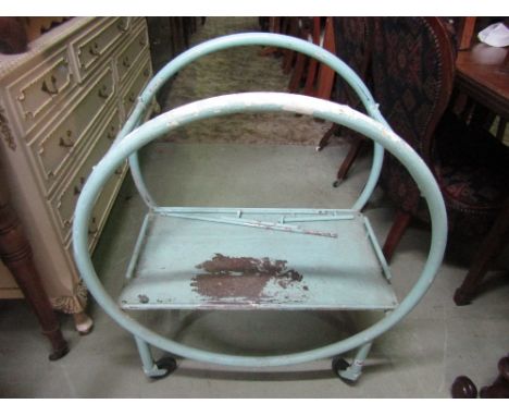 A vintage Art Deco style tubular steel framed two tier tea trolley of hooped form with later painted finish