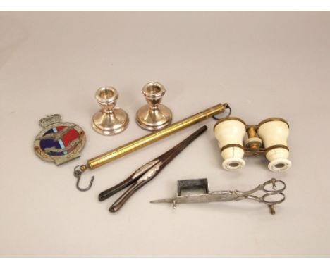 A pair of modern silver squab candlesticks, ivory opera glasses, troy oz silver scales in brass Royal Air Force enamel grill 