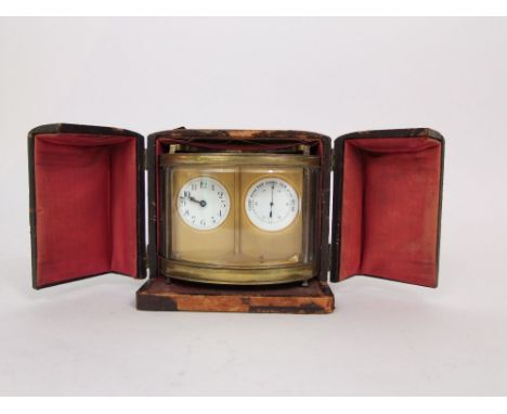 An attractive brass oval carriage clock barometer, with open escapements and bevelled glass front and sides, within a Morocco