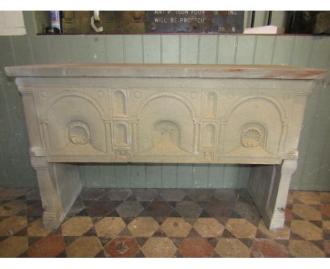 A buff coloured stone after type table the front elevation triple carved arcaded with classical doric columns, shell, portrai