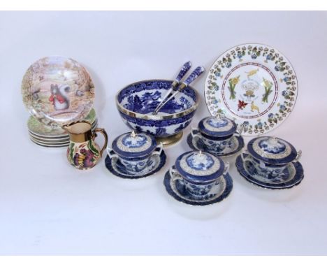 A 19th century blue and white printed willow pattern salad bowl with plated mounts to the rim and base together with a pair o