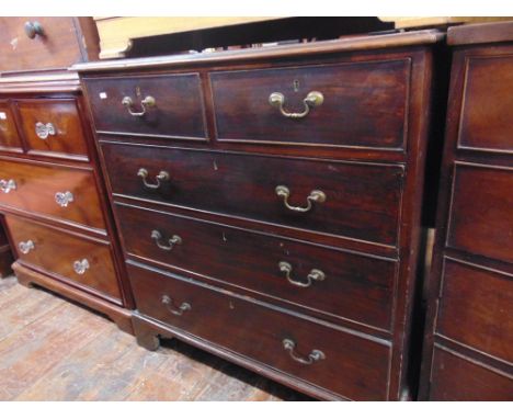 A Georgian mahogany chest of three long and two short drawers, oak lined and raised on bracket supports, 96 cm wide approx.