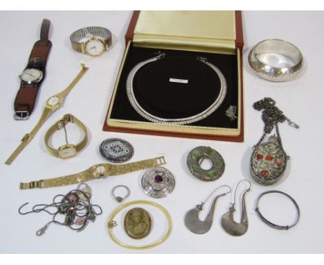 A boxed Cleopatra style necklace, two brooches and a christening bangle; all silver, five wristwatches, an engine turned bang