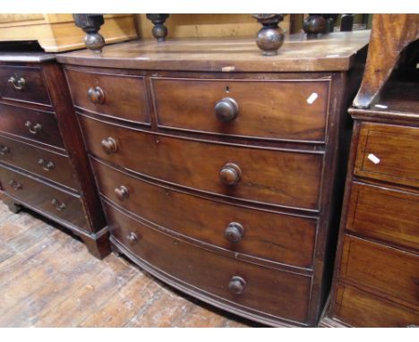 A mid-Victorian mahogany and oak lined bow fronted chest of three long and two short drawers on short bracket supports, 107 c