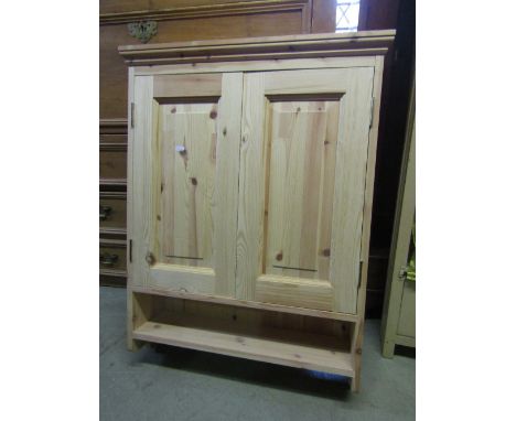 A new pine hanging wall cupboard enclosed by two panelled doors with open shelf below, 70 cm wide