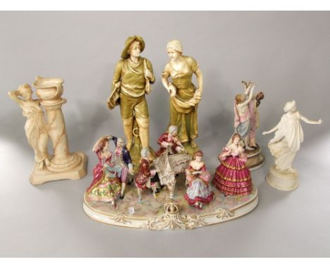 A large continental ceramic group of dancers and musicians in 18th century style costume with blue crown mark to base, 47cm l