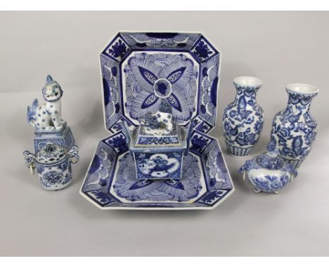 An interesting collection of oriental and oriental style blue and white wares including a two handled box and cover with dog 