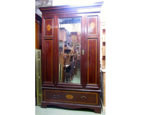 A good quality inlaid Edwardian mahogany wardrobe with satin wood banding and shell/fan paterae, moulded cornice over a centr