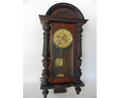 A two train Vienna type drop dial wall clock, with 5" gilt dial in an architectural case, key and pendulum, 65cm high