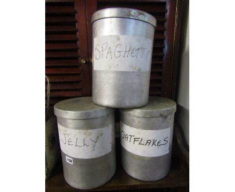 Three aluminium cylindrical containers complete with lids, together with a vintage lamp