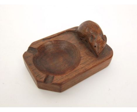 A Mouseman ash tray in oak