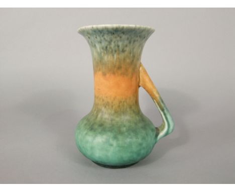 A Ruskin pottery jug by William Howson Tayler with mottled green, orange and grey glaze, angular handle and impressed marks t