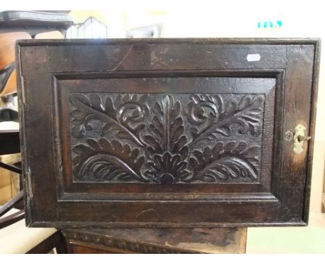 An old English oak side cupboard, the panelled door with oak leaf detail; together with a further walnut veneered shelf enclo