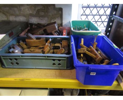 Four boxes containing a quantity of vintage wood working planes of varying design