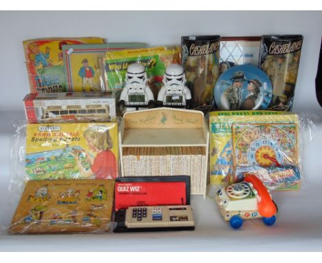 A collection of various vintage child's toys to include Fisher-Price, various electrical tools, a Peter Rabbit bookshelf with