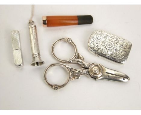 A mixed bijouterie and smoking lot to include a silver vesta case, a silver cigar piercer, engine turned 835 white metal ladi