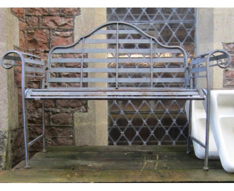 A contemporary light steel two seat garden bench with arched back, scrolled arms, strap work seat