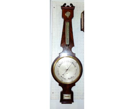 A large 19th century flame mahogany wheel barometer by C.A. Canti of Town Malling, Kent, with silvered back plates and mercur