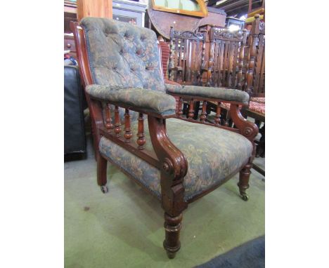 A Victorian library/drawing room chair with upholstered seat, arm rests and button back within a mahogany show wood frame rai